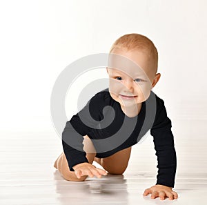 Pretty crawling baby isolated on white background
