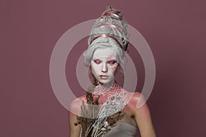 Pretty creative fashionable carnival model woman blonde, fashion beauty studio portrait