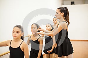 Pretty dance teacher coaching some girls