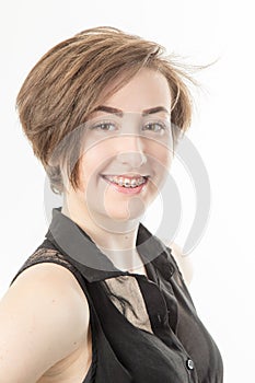 pretty dark haired teenage girl with braces smiling