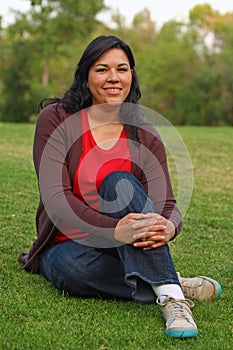 Pretty dark haired woman on grass