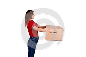 Pretty delivery girl is giving a cardboard box to a customer isolated on white background