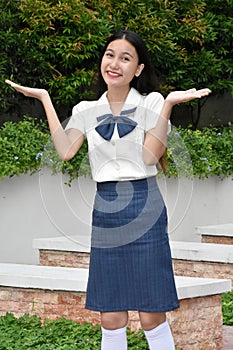 Pretty Diverse Girl Student And Indecisiveness Wearing Skirt Standing