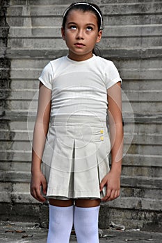 Pretty Diverse Kids And Apathy Wearing Skirt In Front Of Wall