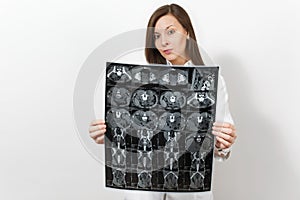 Pretty doctor woman hold behind x-ray radiographic image ct scan mri isolated on white background. Female doctor in