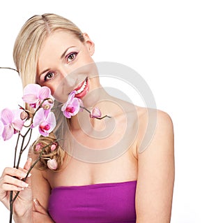 Pretty elegant woman holding an orchid