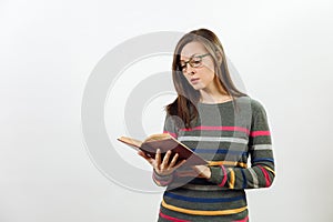 Pretty European happy brown-haired woman with healthy clean skin dressed in casual longsleeve on a white background