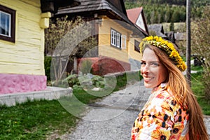 Pretty face girl posing in old historical village Vlkolinec at Slovakia