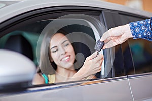 Pretty female buy a new car. Success and lifestyle concept.