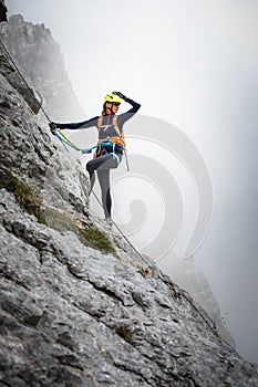Pretty, female climber on a via ferrata