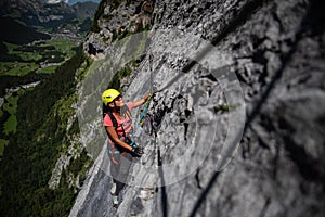 Pretty, female climber on a via ferrata