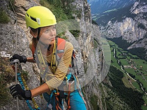 Pretty, female climber on a via ferrata