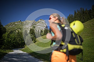 Pretty, female climber on a via ferrata