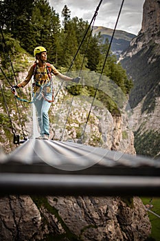 Pretty, female climber on a via ferrata