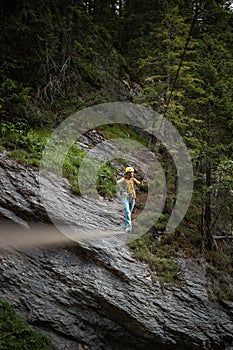 Pretty, female climber on a via ferrata