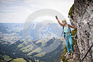 Pretty, female climber on a via ferrata