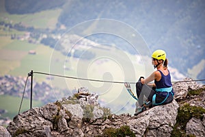 Pretty, female climber on a via ferrata