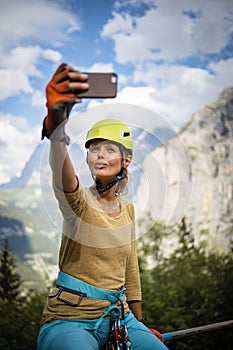 Pretty, female climber on a via ferrata