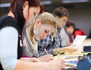 Pretty female college student in a classroom