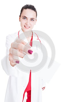 Pretty female medic offering business card