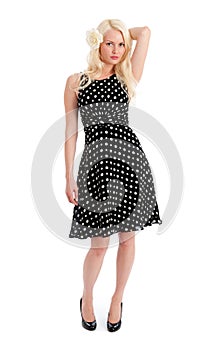 Pretty female in polker dot dress isolated