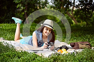 Pretty female tourist relaxing in park