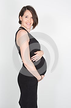 pretty fit beauty pregnant woman in black dress