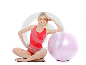 Pretty fitness woman exercise with pilates ball