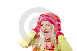 Pretty funny winter woman in hat and gloves scream