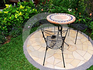 Pretty garden with paving and furnitures