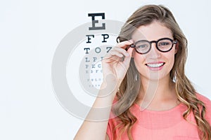 Pretty geeky hipster with glasses and eye test