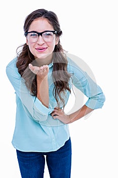 Pretty geeky hipster sending kiss to camera photo