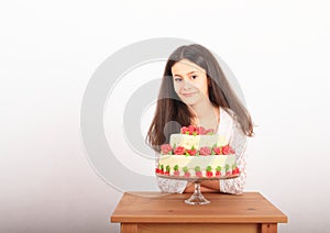 Pretty girl with anniversary cake