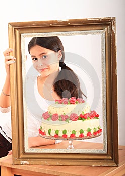 Pretty girl with anniversary cake in frame