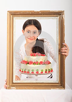 Pretty girl with anniversary cake in frame