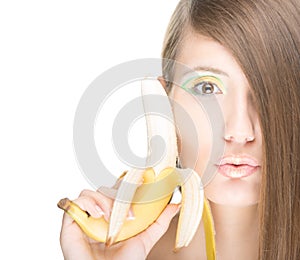 Pretty girl with banana isolated on white.