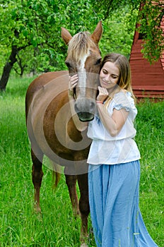 Pretty girl and bay peasant horse