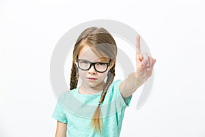 Pretty girl with black glasses and plaits in front of white background in the studio