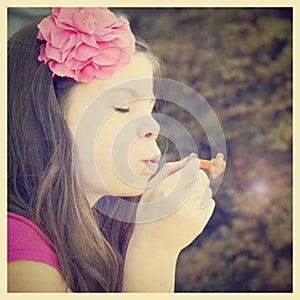 pretty girl blowing bubbles