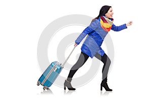 Pretty girl in blue winter jacket with suitcase