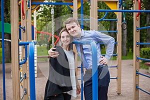 Pretty girl and boy hugging outdoor. Young couple