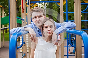 Pretty girl and boy together. Young couple outdoor portrait