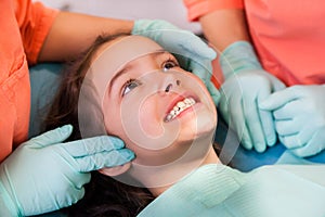 Pretty girl at the dentist, examination of the tempromandibular joint