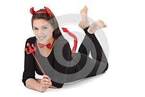 Pretty girl in devil costume smiling