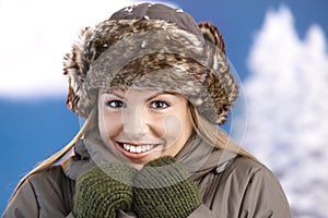 Pretty girl dressed up warm smiling freezing