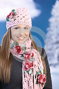 Pretty girl dressed up warm smiling wintertime