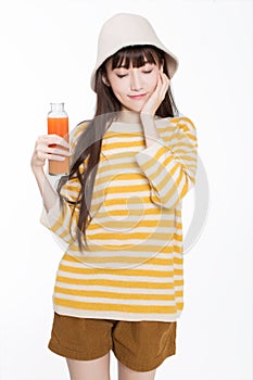 Pretty girl drinking juice