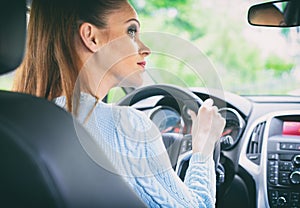 Pretty girl driving car