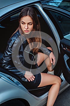 Pretty girl exiting car