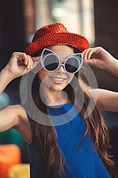 Pretty girl in eyeglasses posing for the photo